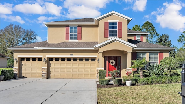 view of front of property featuring a garage and a front lawn