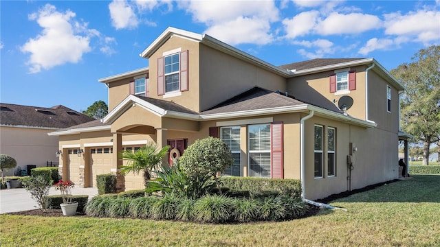 front facade with a front yard and a garage