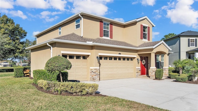 view of front facade featuring a front lawn and a garage