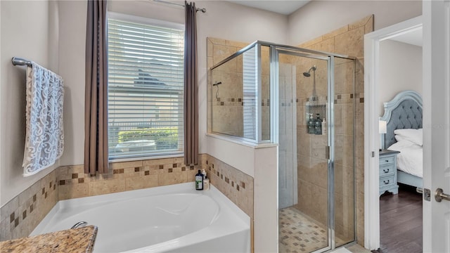 bathroom featuring independent shower and bath and wood-type flooring