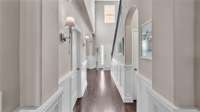 corridor featuring dark hardwood / wood-style flooring