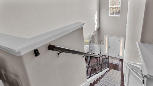 stairs with hardwood / wood-style floors