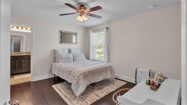 bedroom featuring connected bathroom, ceiling fan, dark hardwood / wood-style floors, and a textured ceiling