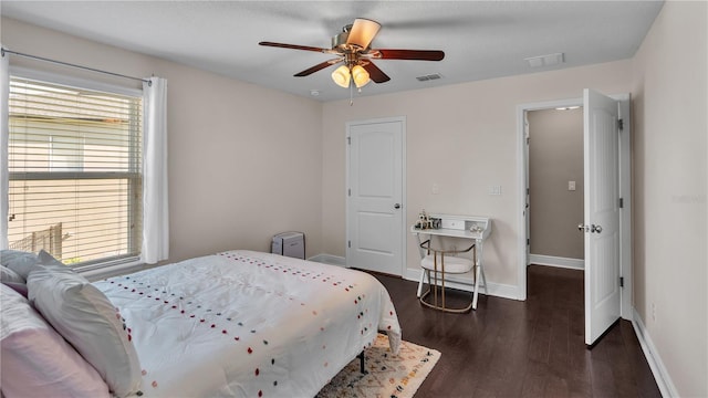 bedroom with ceiling fan and dark hardwood / wood-style flooring