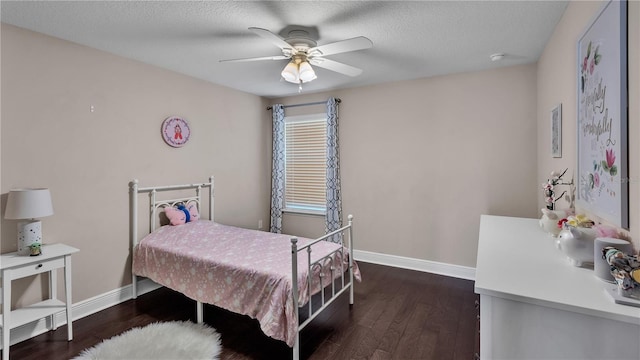 bedroom featuring a textured ceiling, dark hardwood / wood-style flooring, and ceiling fan