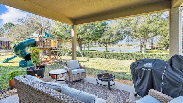 view of patio featuring a playground and grilling area