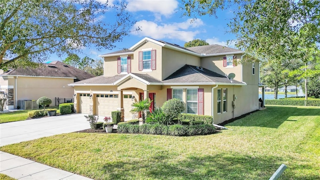 view of front of home featuring a front yard and a garage