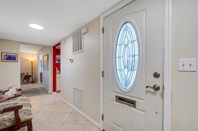 foyer featuring light tile patterned flooring