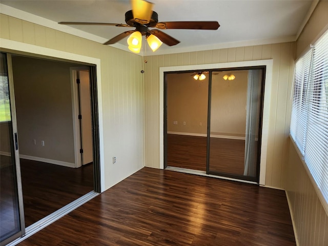 unfurnished bedroom with ceiling fan, a closet, crown molding, and dark hardwood / wood-style flooring