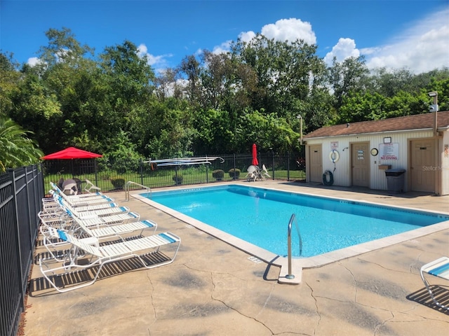 view of swimming pool with a patio