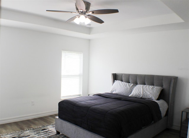 bedroom featuring ceiling fan and hardwood / wood-style flooring