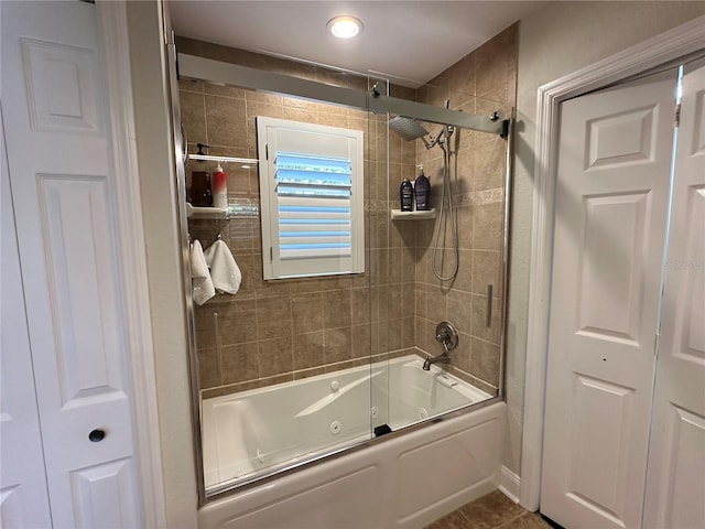 bathroom with tile patterned flooring and a combined bath / shower with jetted tub