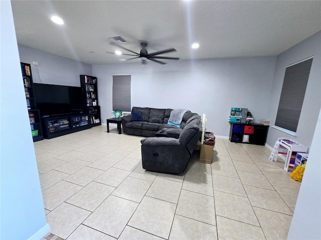 tiled living room featuring ceiling fan