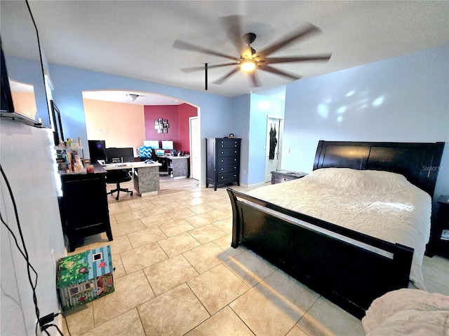 bedroom with light tile patterned floors and ceiling fan