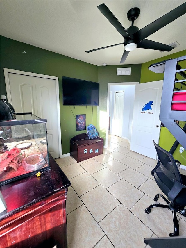 office with light tile patterned flooring and ceiling fan