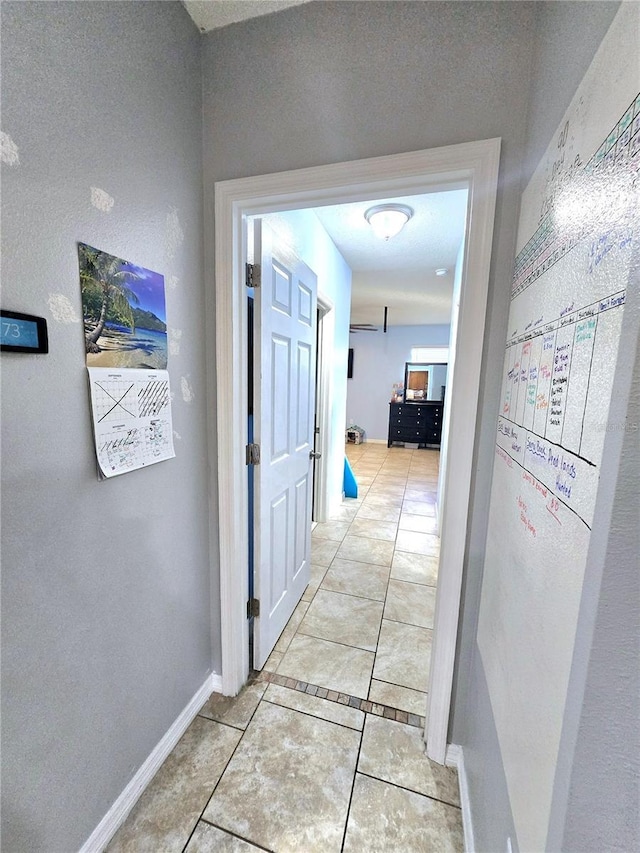 hall with light tile patterned flooring