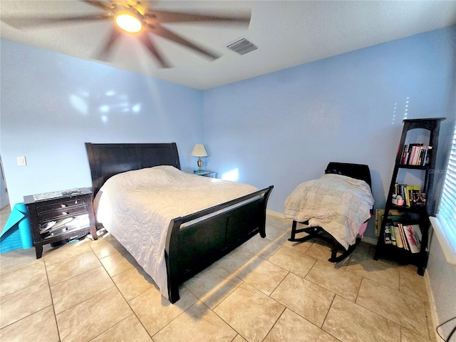 bedroom featuring ceiling fan and light tile patterned flooring