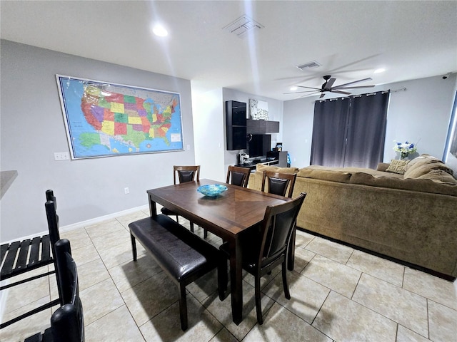 dining area featuring light tile patterned floors and ceiling fan