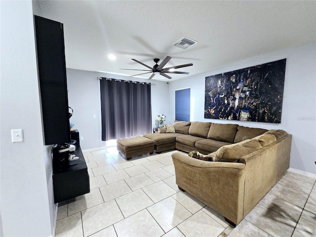 tiled living room with ceiling fan