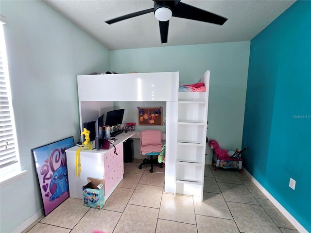 bedroom featuring ceiling fan and light tile patterned floors