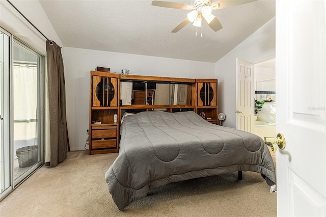 bedroom with vaulted ceiling, ceiling fan, light colored carpet, and a textured ceiling