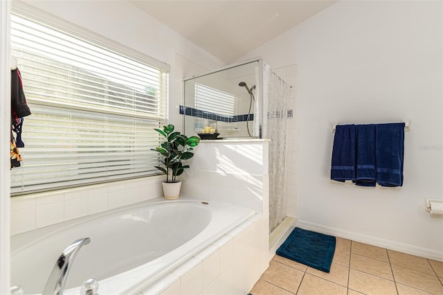 bathroom featuring plus walk in shower, lofted ceiling, and tile patterned floors