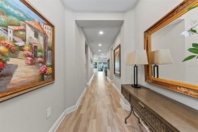 hallway with light wood-type flooring