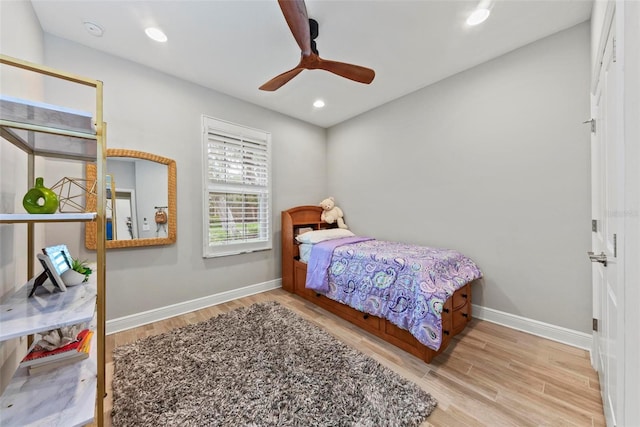 bedroom featuring light hardwood / wood-style flooring and ceiling fan