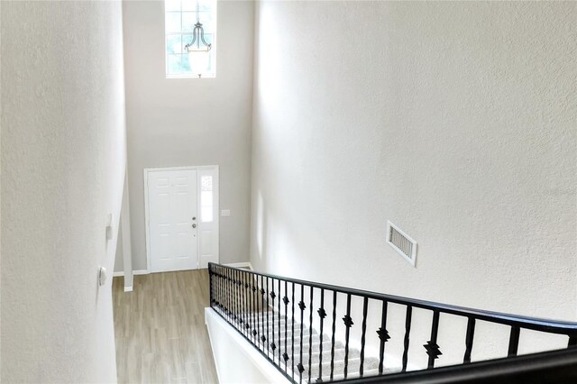 corridor with light hardwood / wood-style floors