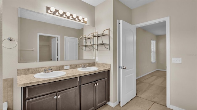 bathroom featuring tile patterned flooring and vanity