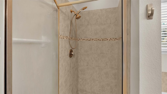 bathroom featuring an enclosed shower