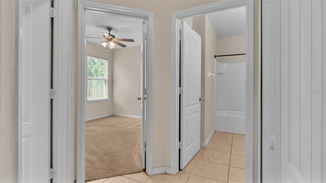 hallway with light tile patterned flooring