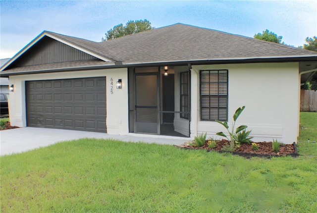 ranch-style house with a front yard and a garage