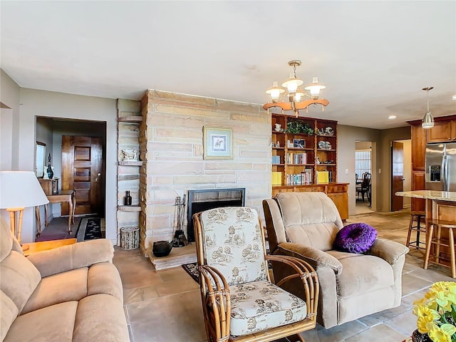 living room featuring a fireplace and an inviting chandelier