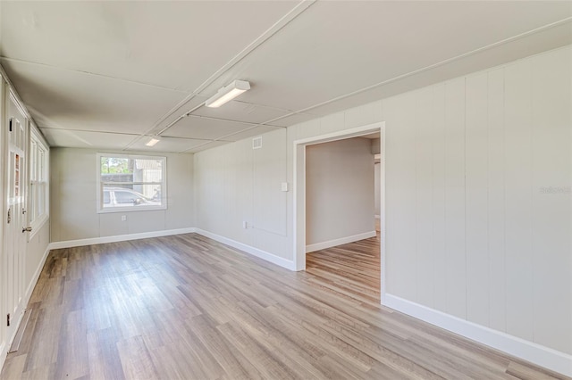 spare room featuring light wood-type flooring