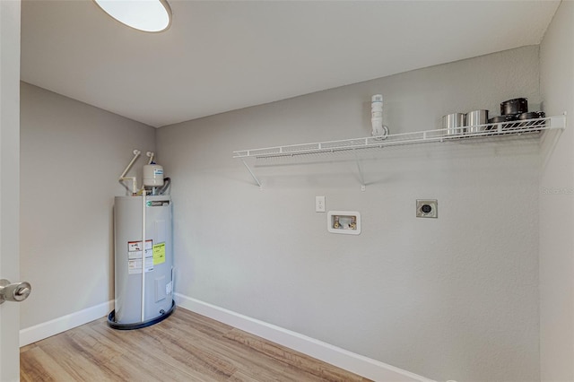 laundry area with hookup for an electric dryer, electric water heater, hookup for a washing machine, and hardwood / wood-style floors