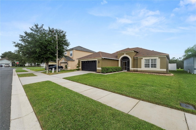 view of front of property with a garage and a front lawn