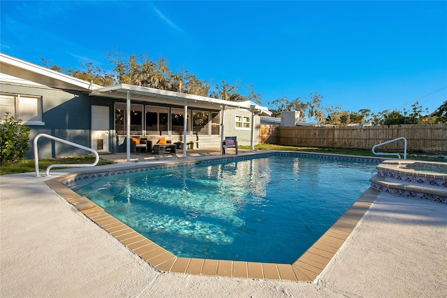 view of swimming pool with an in ground hot tub and a patio