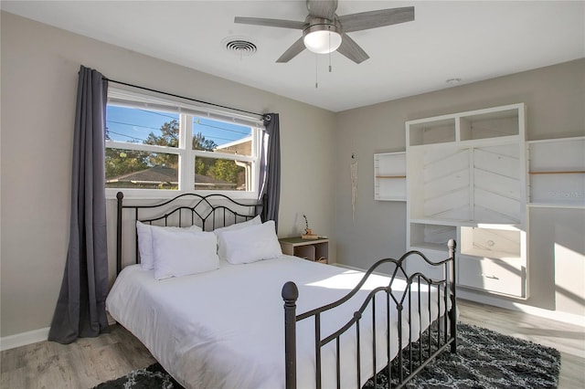 bedroom featuring ceiling fan and hardwood / wood-style floors