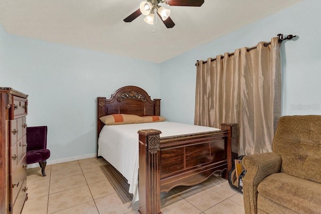 tiled bedroom featuring ceiling fan