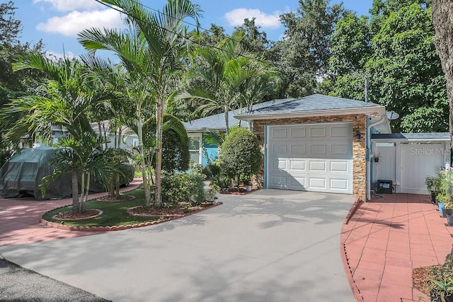 ranch-style home featuring a garage