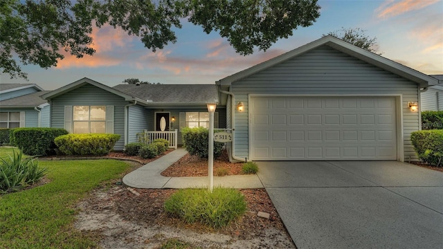 ranch-style house featuring a garage