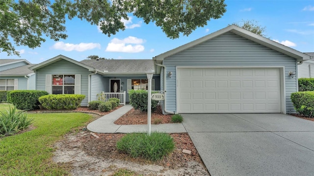 single story home featuring a garage, a front lawn, and a porch