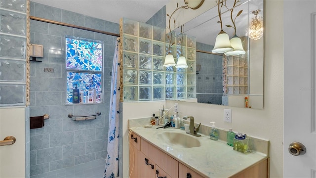 bathroom with vanity and curtained shower