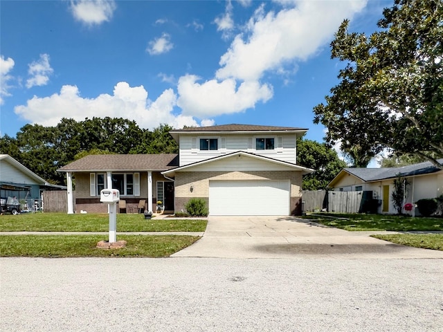 split level home with a garage and a front lawn