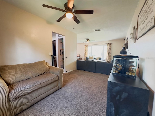 carpeted living room featuring ceiling fan