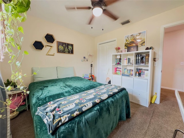 bedroom with a closet, carpet, and ceiling fan