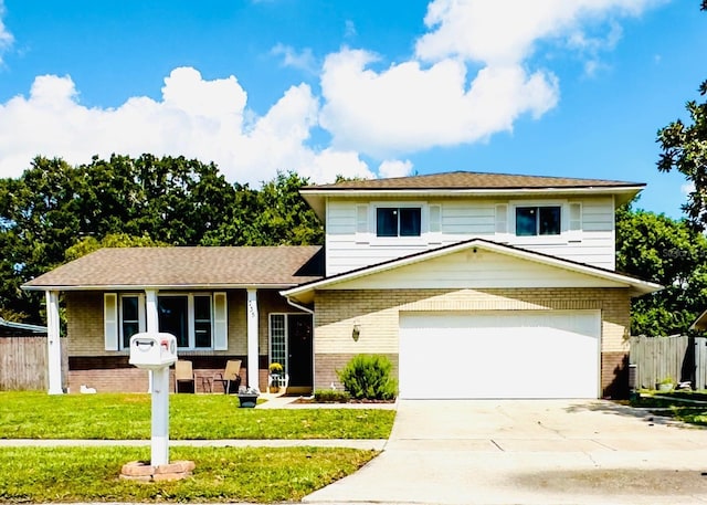 view of front of property with driveway, fence, a front lawn, and brick siding