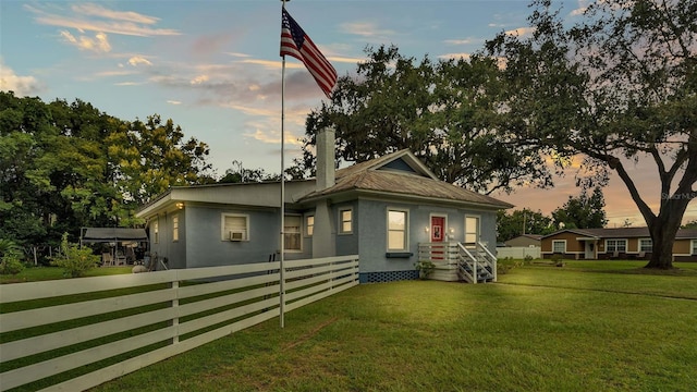 view of front of home featuring a yard