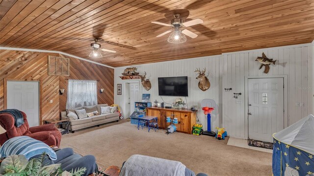 living room featuring vaulted ceiling, ceiling fan, wooden ceiling, and carpet floors